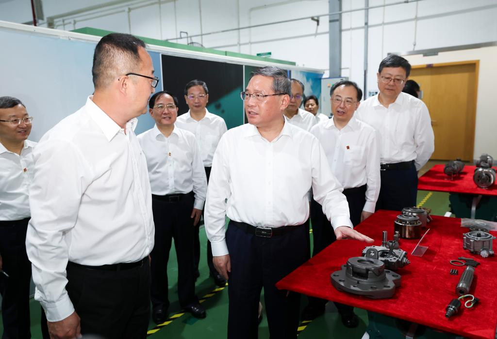Chinese Premier Li Qiang, also a member of the Standing Committee of the Political Bureau of the Communist Party of China Central Committee, inspects the Volvo Construction Equipment (China) Co., Ltd. in Shanghai, east China, July 27, 2023. /Xinhua 