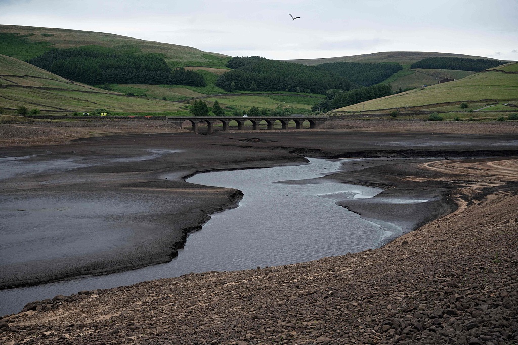 The bed of Woodhead Reservoir is revealed by a falling water level near Glossop, northern England, July 10, 2023. /CFP