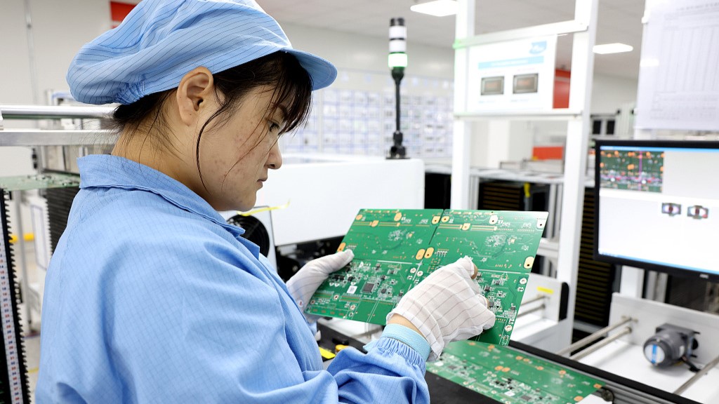 A staff works in a tech company manufacturing plant in southeast China's Fujian Province, July 26, 2023. /CFP