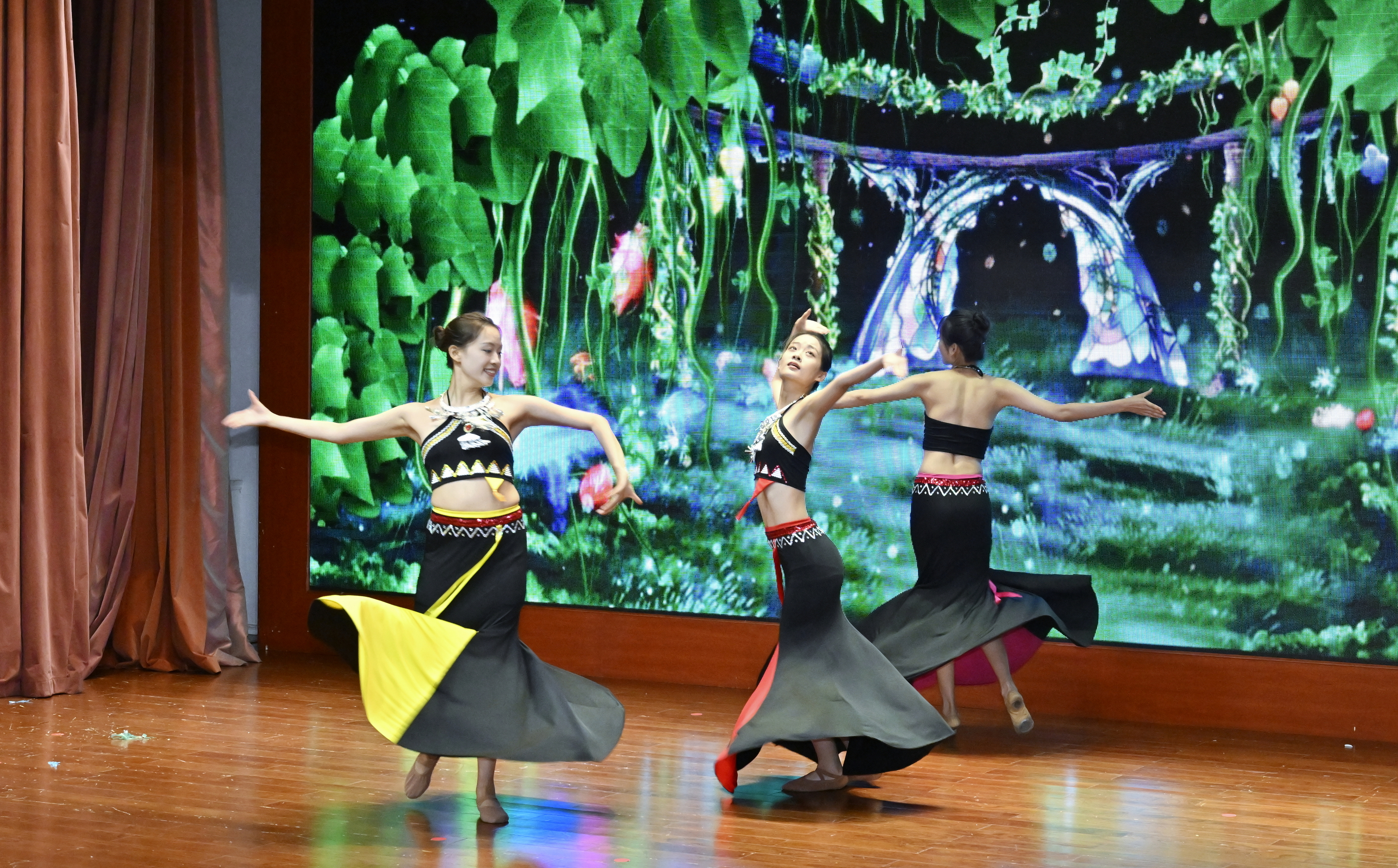 Dancers from Hebei University perform traditional Chinese dance showcasing the charm of the Dai ethnic cultures, in Beijing, China on July 27, 2023. / Photo provided to CGTN