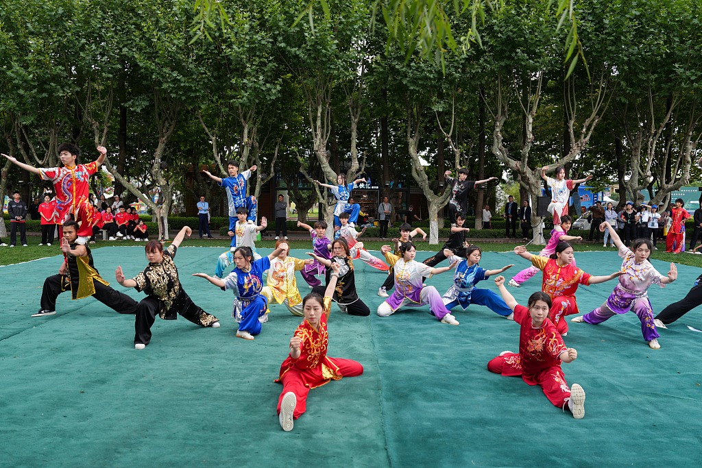 Yoga and Tai Chi are practiced on the banks of the Dianchi Lake in Kunming, Yunnan Province, June 20, 2023, at the opening ceremony of the 2023 International Yoga Day and China (Kunming) South Asian Culture and Art Week, part of the China-India cultural exchange events. /CFP