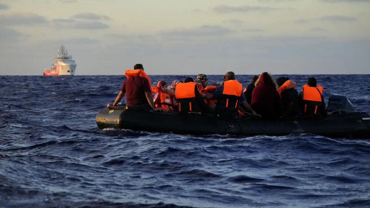 A rescue ship approaches a rubber boat with migrants or trafficked people during a rescue operation at international waters zone  in the  Mediterranean sea, September 15, 2022. /CFP