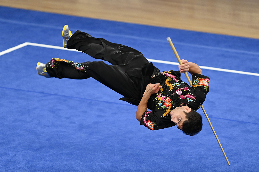 Seyedmohammad Hosseini of Iran competes during the Wushu men's Gunshu event at the World University Games in Chengdu, China, July 30, 2023. /CFP