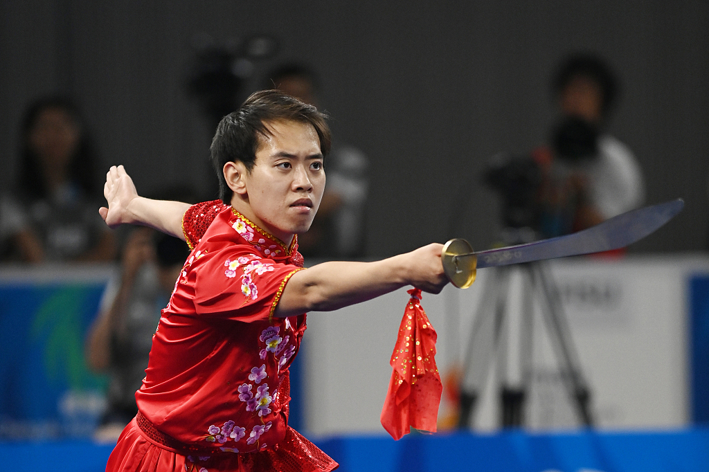 Jin Zhedian of China competes in the Wushu men's Daoshu event at the World University Games in Chengdu, China, July 30, 2023. /CFP