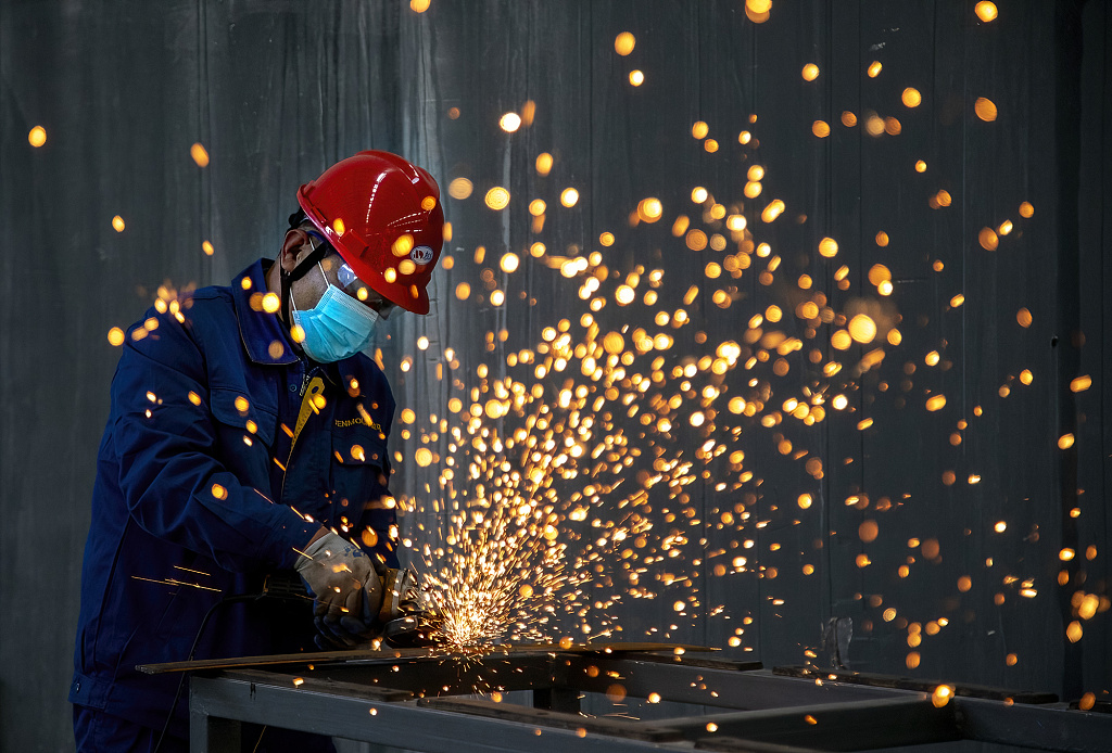 Worker welding in a workshop in Lianyungang, Jiangsu Province, May 31, 2023. /CFP