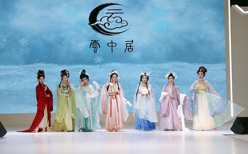 Models show off beautiful hanfu costumes at a themed hanfu fashion show in Shanghai, July 30, 2023. /CFP