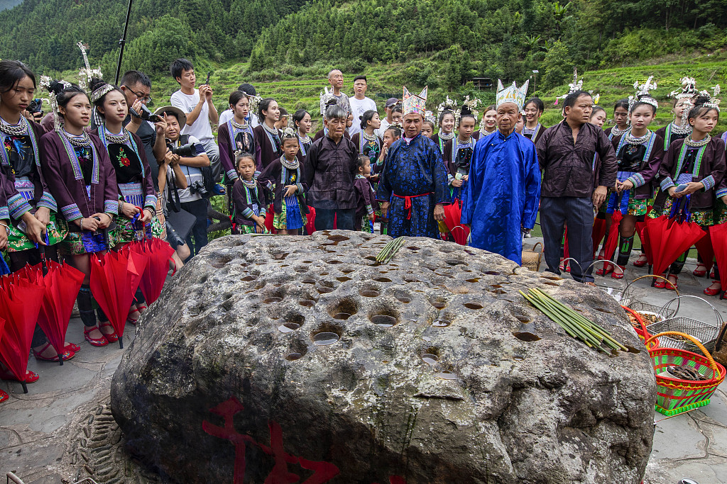 This photo, taken on July 31, 2023, shows the Zhuang people paying their respects to the 