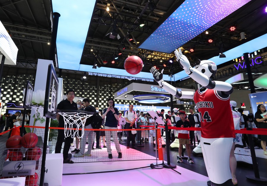 A robot performs shooting at the basket during the World Artificial Intelligence Conference (WAIC) 2023 in Shanghai, east China, July 6, 2023. /Xinhua