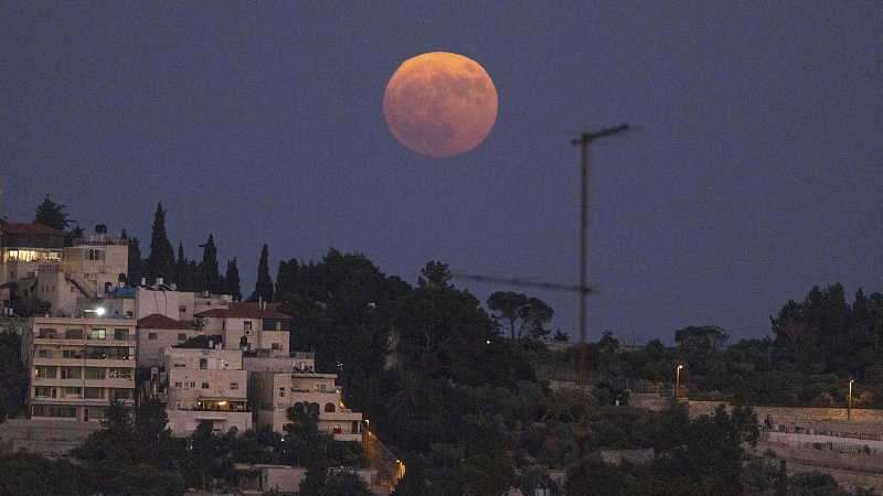 The supermoon rises above the Mount of Olives in Jerusalem, August 1, 2023. /CFP