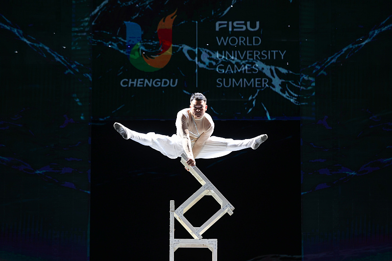 A stuntman shows off difficult moves during a show to celebrate the Chengdu 2021 Summer World University Games in Chengdu City, Sichuan Province, August 2, 2023. /CFP