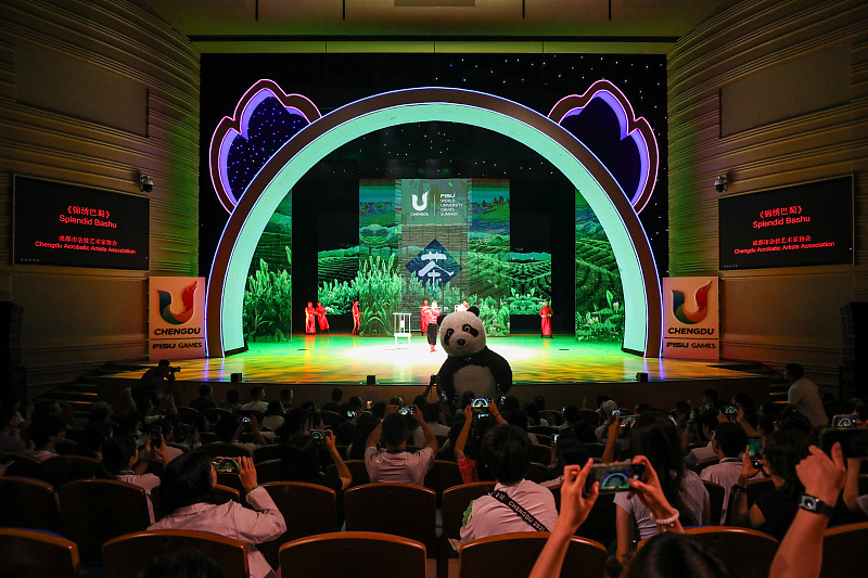Audience members take photo of performers at a show to celebrate the Chengdu 2021 Summer World University Games in Chengdu City, Sichuan Province, August 2, 2023. /CFP