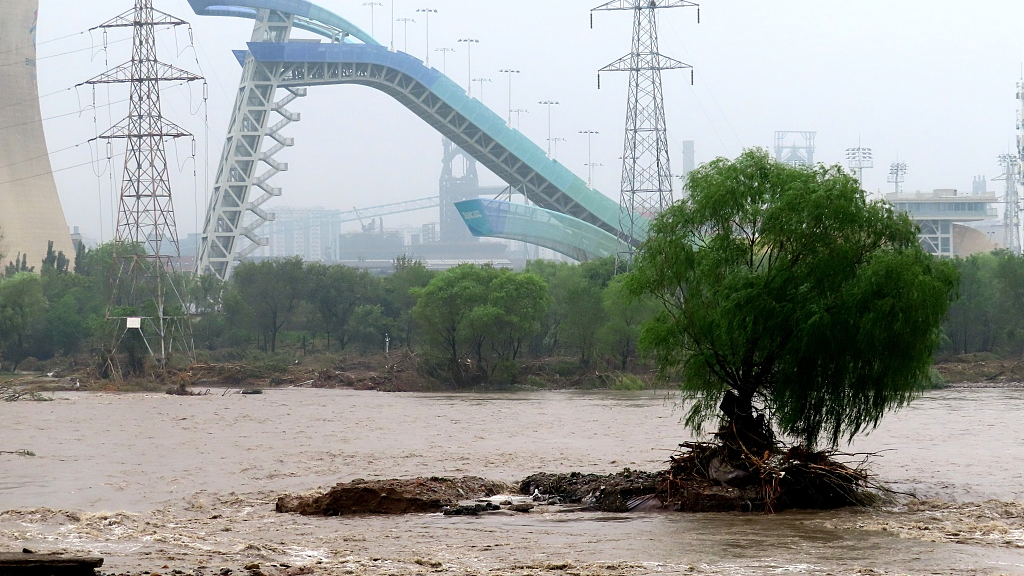 The current in the Winter Olympic Park section of the Yongding River washes away some landscape facilities and trails on both sides of the river, Beijing, China, August 2, 2023. /CFP