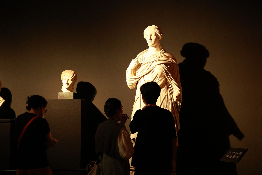 Visitors view sculptures at an exhibition on ancient Roman culture at the Nanshan Museum in Shenzhen, south China's Guangdong Province, August 2, 2023. /CFP