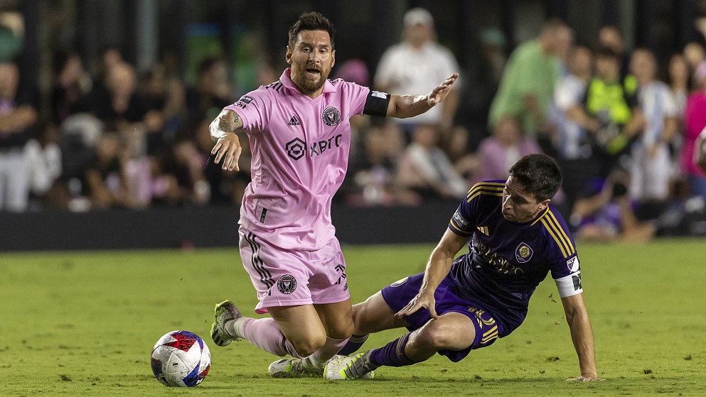 Inter Miami's Lionel Messi goes to ground after being challenged by Orlando City midfielder Mauricio Pereyra during their Leagues Cup match at DRV PNK Stadium in Fort Lauderdale, U.S., August 2, 2023. /CFP