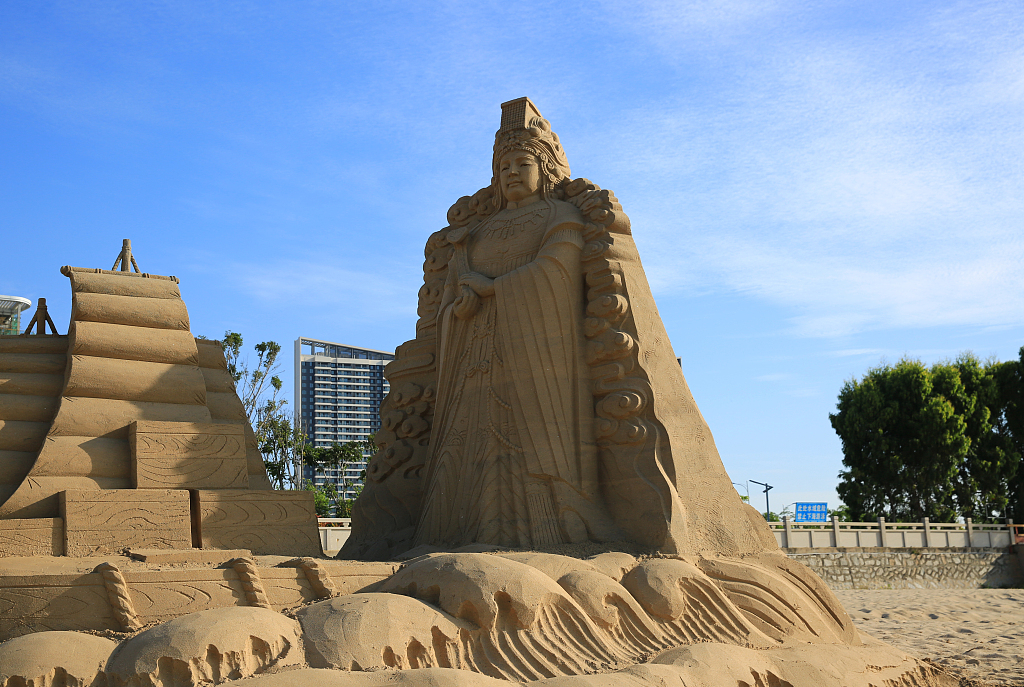 A sand sculpture of sea goodness Mazu stands at the Yushawan Park in Quanzhou, Fujian Province, on July 14, 2023, as part of a cross-Strait cultural exchange activity held in the coastal city. /CFP