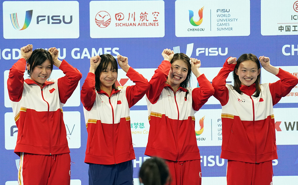 L-R: Liu Yaxin, Jing Shangbeihua, Zhang Yufei, and Li Bingjie of China celebrate on the podium after winning the women's 4X200m freestyle relay title at the World University Games in Chengdu, China, August 4, 2023. /CFP
