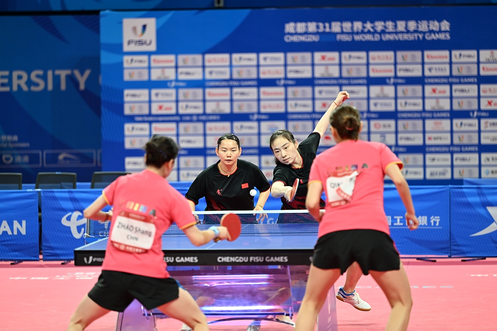 Zhao Shang (L)/Qian Tianyi (in pink) and He Zuojia (2nd L)/Wang Xiaotong (in black) play in the all-Chinese table tennis women's doubles final at the World University Games in Chengdu, China, August 4, 2023. /CFP
