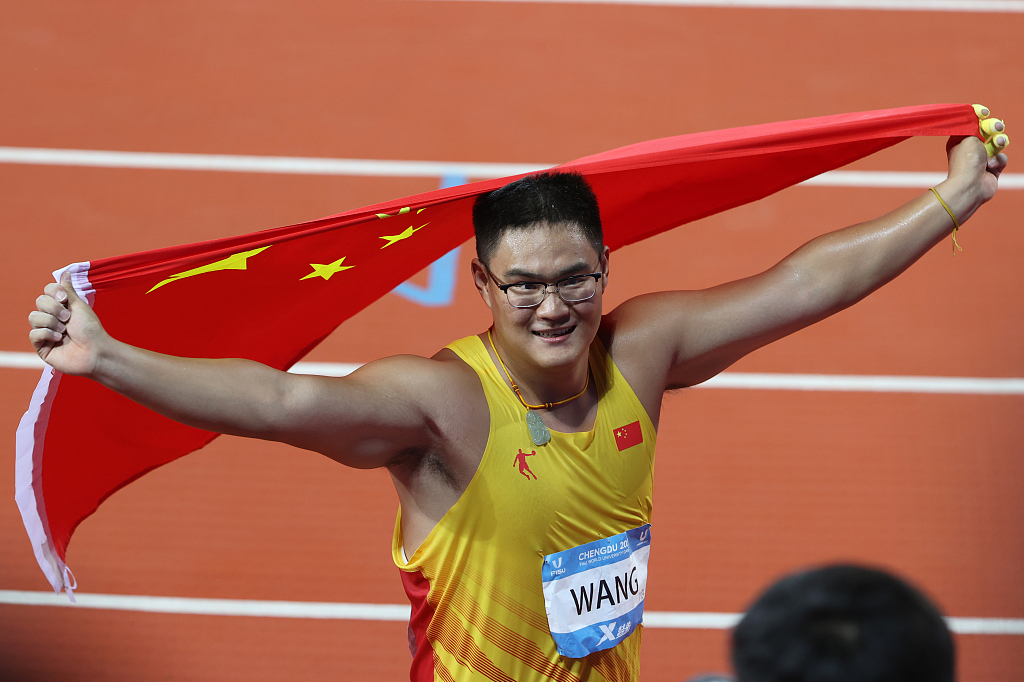 Wang Qi of China celebrates after winning the men's hammer throw final at the World University Games in Chengdu, China, August 4, 2023. /CFP