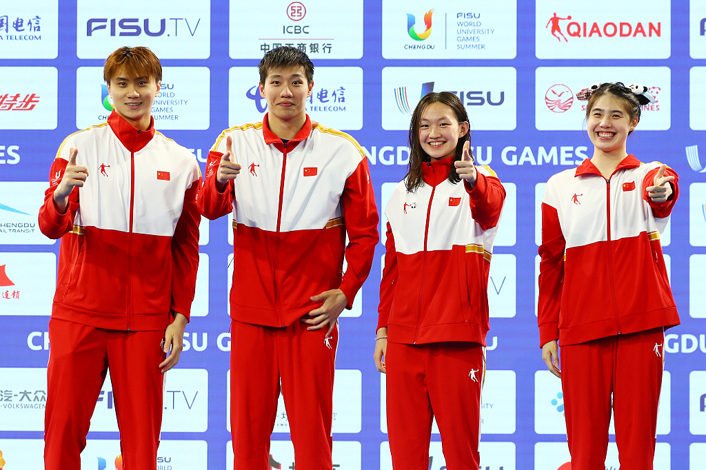 L-R: Chen Juner, Lin Tao, Li Bingjie and Zhang Yufei of China celebrate on the podium after winning the mixed 4X100m freestyle relay final at the World University Games in Chengdu, China, August 5, 2023. /CFP