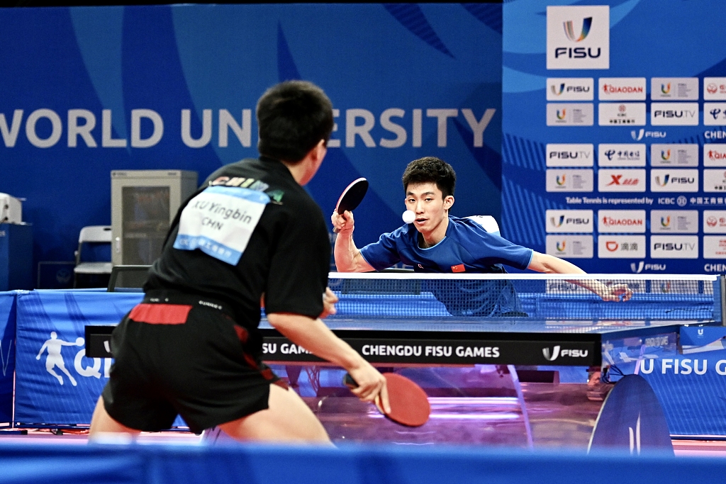 Zhou Kai (R) of China plays against compatriot Xu Yingbin during the men's table tennis singles final at the World University Games in Chengdu, China, August 5, 2023. /CFP