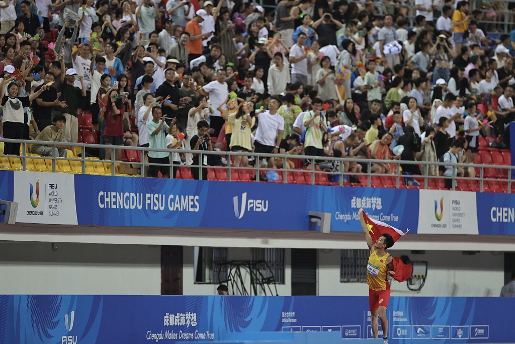 China Zhang Jingqiang celebrates after winning the gold medal in the men's long jump final at the World University Games in Chengdu, China, August 6, 2023. /CFP