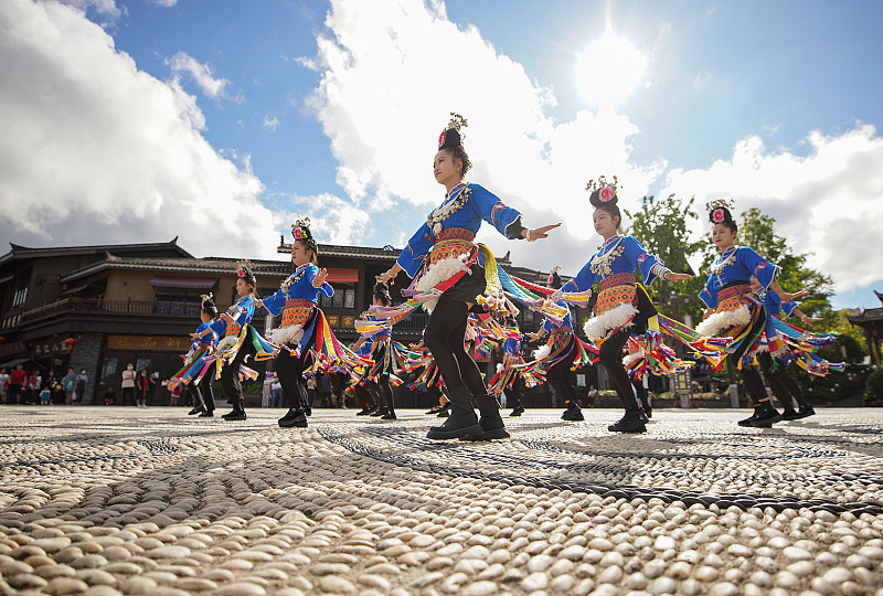 Miao women show off their traditional folk dances in Danzhai County, Guizhou Province. /CFP