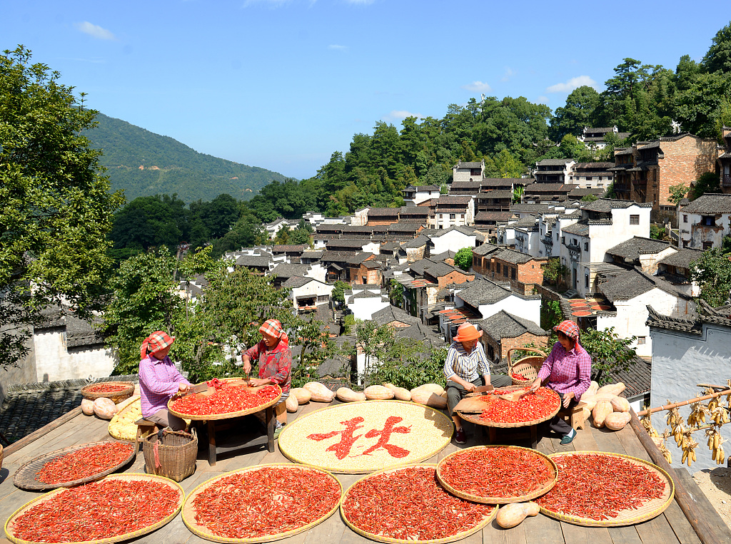 A file photo shows villagers sun-drying red chilis to welcome autumn in Shangrao, Jiangxi Province, China. /VCG