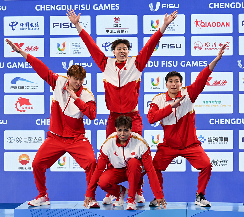 Chinese swimmers celebrate after setting a new FISU record in the men's 4X100m medley relay event at the World University Games in Chengdu, China, August 7, 2023. /CFP