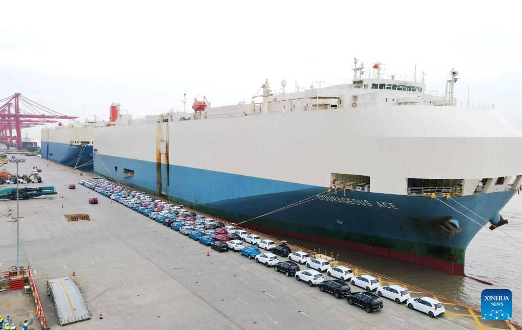 An aerial photo shows MG cars produced by Shanghai Automotive Industry Corp (SAIC) to be shipped to Australia at Shanghai Haitong International Automotive Terminal in Waigaoqiao of east China's Shanghai, July 9, 2023. /Xinhua