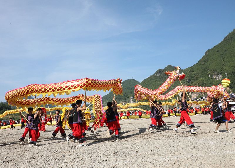 Miao people perform dragon dances to celebrate the Ganqiu Festival in Huayuan County, Hunan Province. /CFP