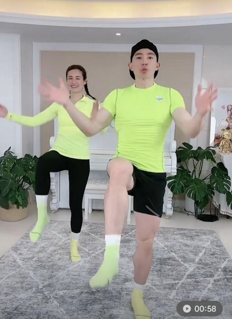 A screenshot of Chinese singer Liu Genghong and his wife livestreaming their workout session on Douyin, or Chinese TikTok. /Xinhua