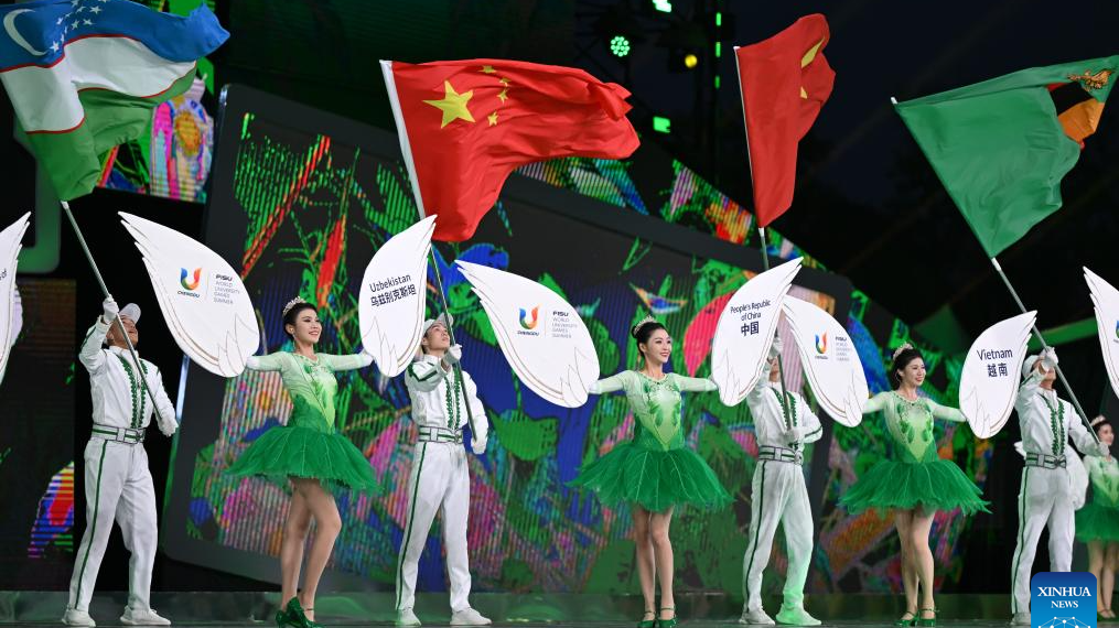 Flag and placard bearers parade during the closing ceremony of the 31st FISU Summer World University Games in Chengdu, southwest China's Sichuan Province, August 8, 2023. /Xinhua