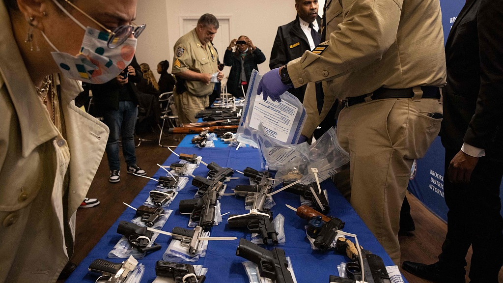 Handguns and firearms are displayed during a statewide gun buyback event held by the office of the New York State attorney general, in the Brooklyn borough of New York, U.S., April 29, 2023. /CFP
