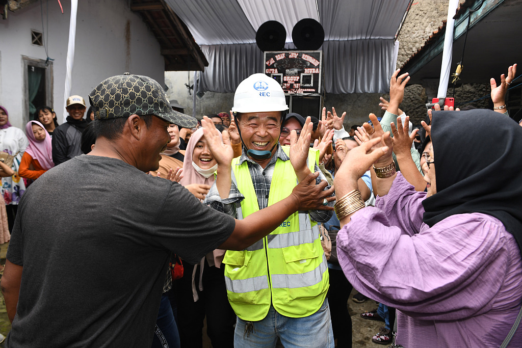 Local residents and Chinese construction workers, who built the Jakarta-Bandung high-speed railway, celebrate the project's completion in Bandung, Indonesia, July 1, 2023. /CFP