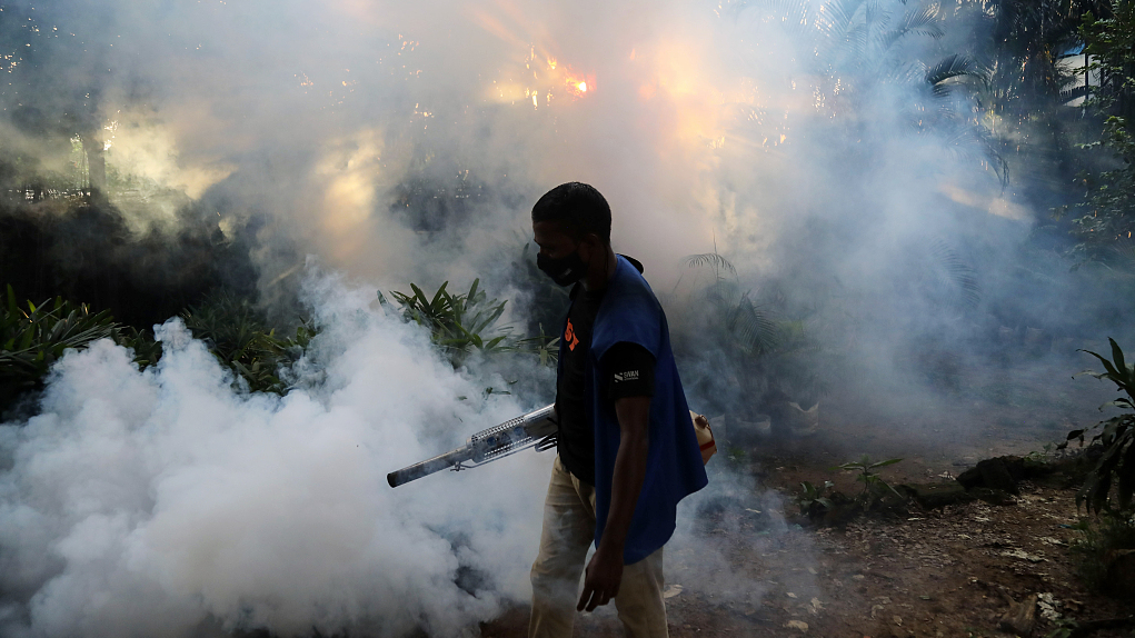 A worker fumigates against the dengue virus in Dhaka, Bangladesh, July 9, 2023. /CFP
