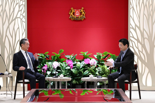 Chinese Foreign Minister Wang Yi (L), also a member of the Political Bureau of the CPC Central Committee, meets with Singaporean Deputy Prime Minister and Minister for Finance Lawrence Wong in Singapore, August 11, 2023. /Chinese Foreign Ministry)
