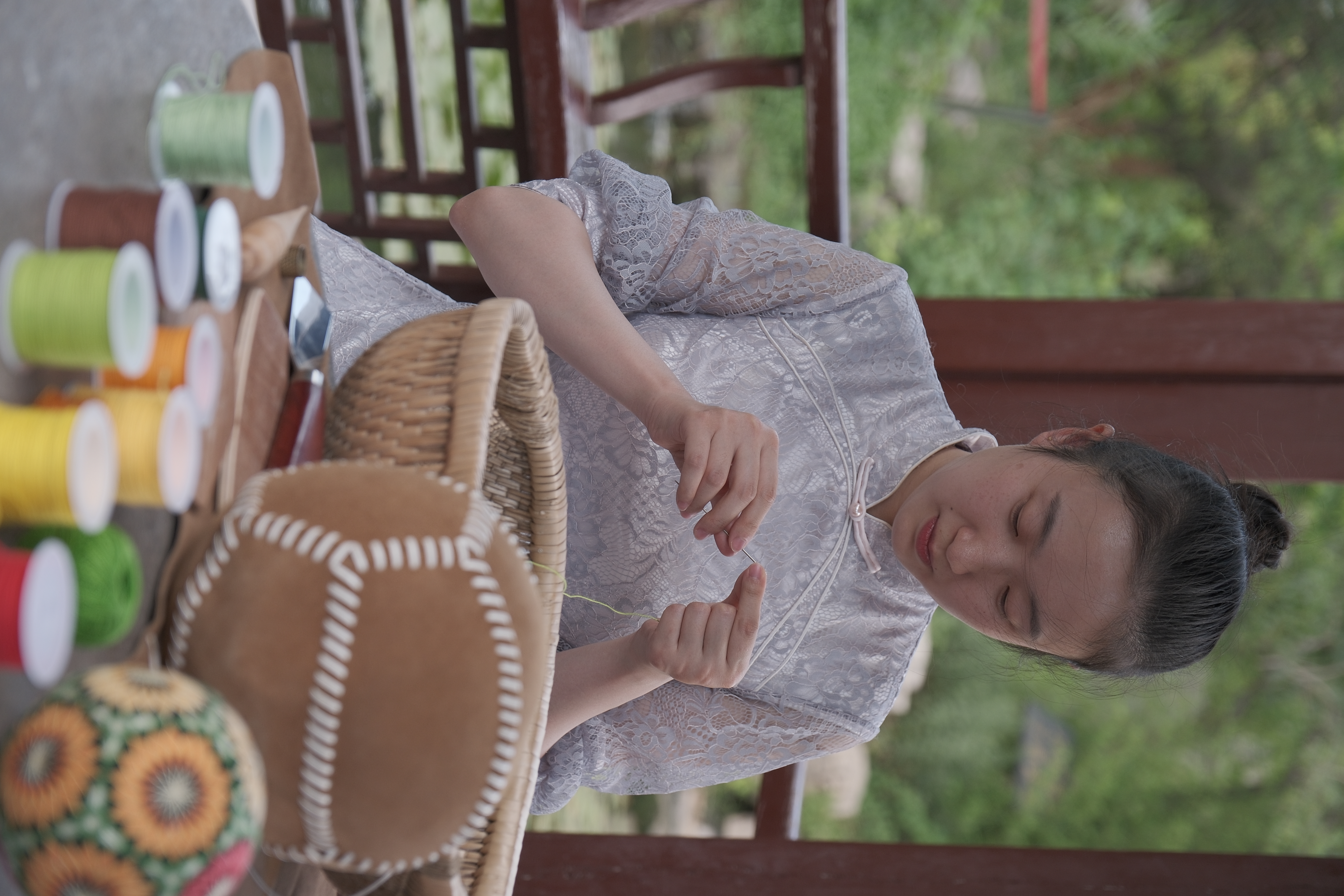 A view of a craftswoman stitching hand-embroidered cuju in Zibo, Shandong Province /CGTN