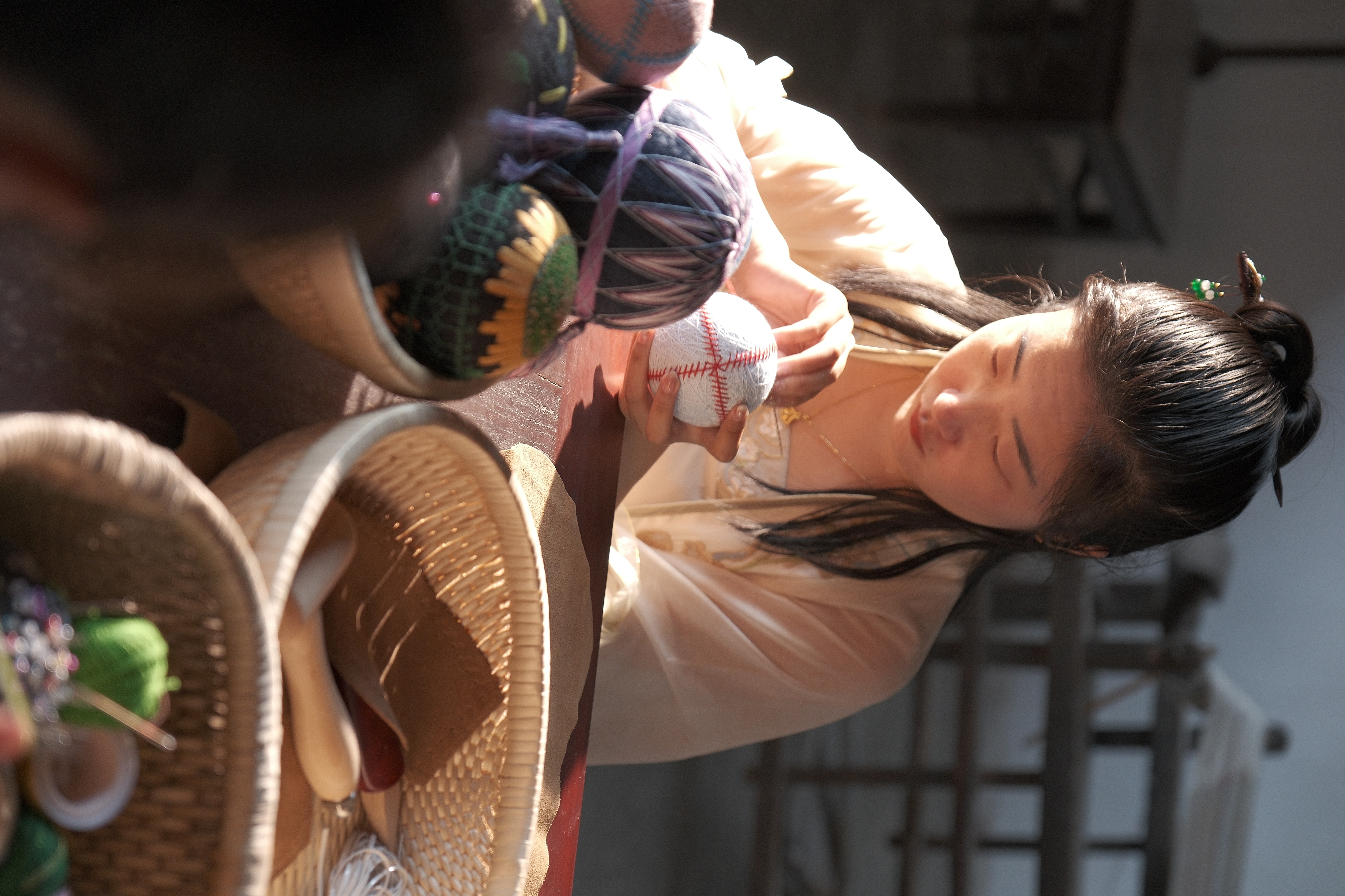 A view of a craftswoman stitching hand-embroidered cuju in Zibo, Shandong Province /CGTN