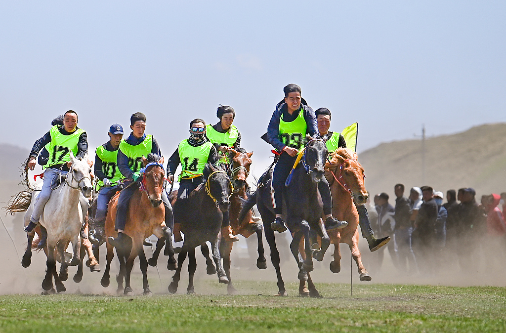 Herdsmen compete in a horse race held in Hinggan League, Inner Mongolia. /CFP