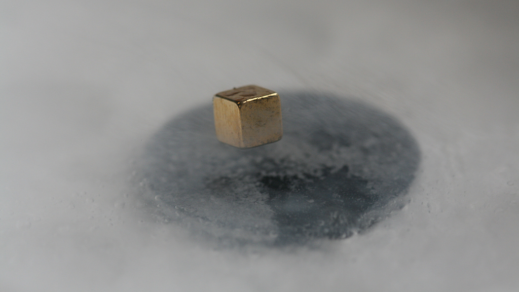 A material levitates in a magnetic field. /CFP
