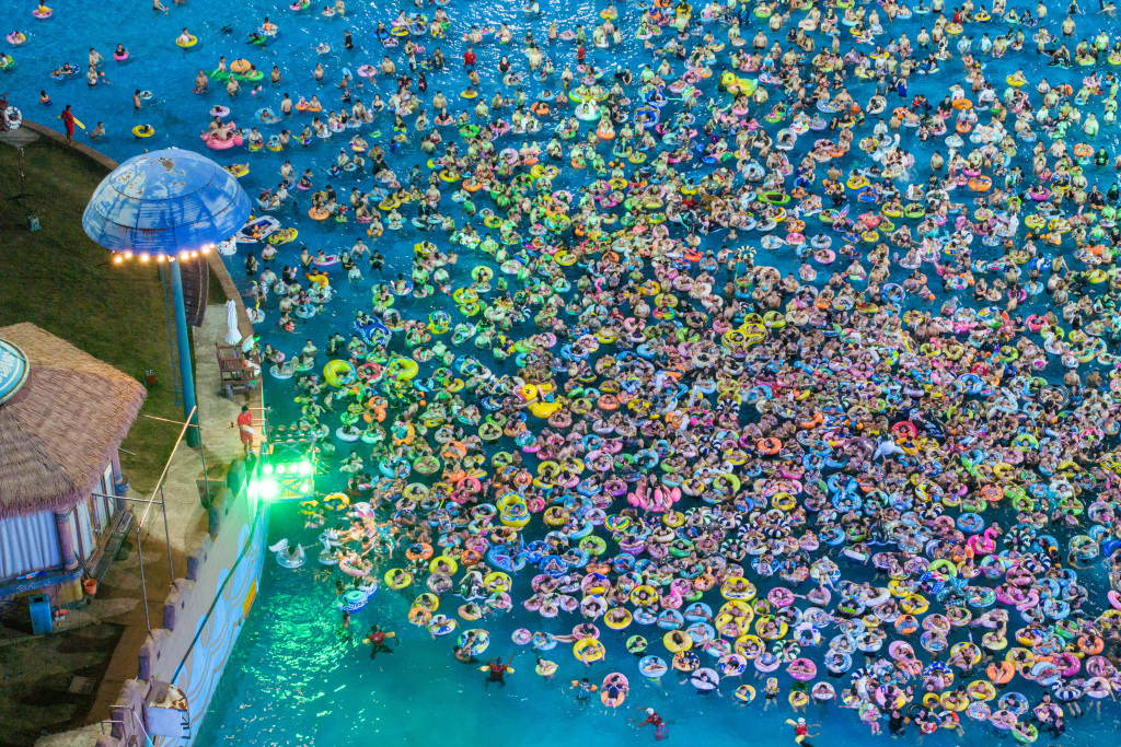 An aerial photo shows people enjoying themselves at a water park in Nanjing, Jiangsu Province, August 12, 2023. /CFP