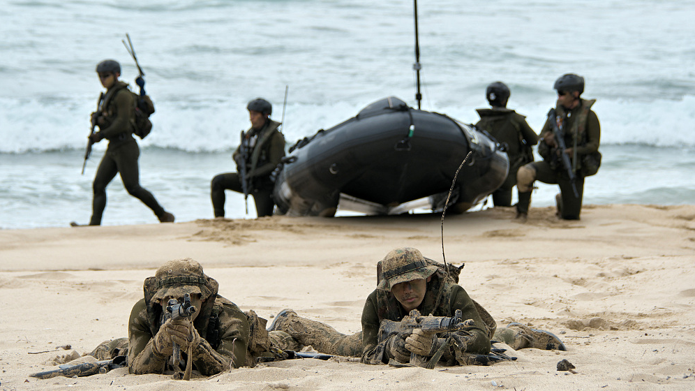 Members of Japan Ground Self-Defense Force's Amphibious Rapid Deployment Brigade land during the joint military exercise with U.S. Marines at Manda Beach in Tokunoshima Island, Kagoshima Prefecture, Japan, March 3, 2023. /CFP