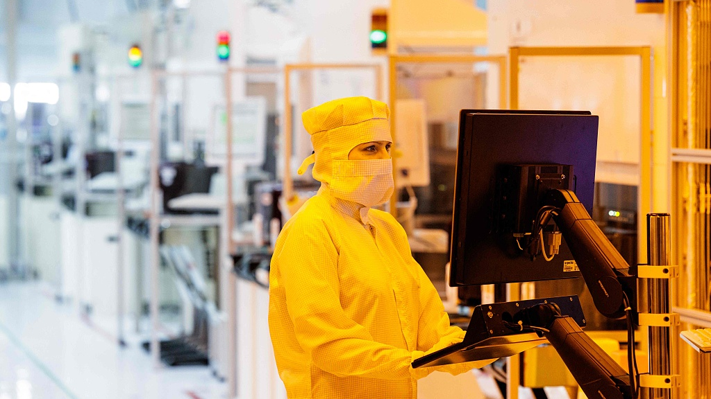 An employee of German semiconductor manufacturer Infineon Technologies AG works in a clean room on the production line of 200-millimeter wafers at the company's plant in Dresden, eastern Germany, April 26, 2023. /CFP