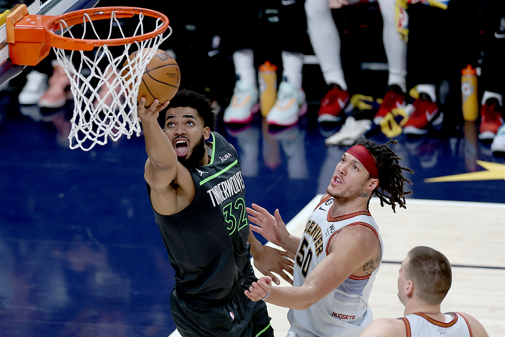 Karl-Anthony Towns (#32) of thge Minnesota Timberwolves drives toward the rim in Game 5 of the NBA Western Conference first-round playoffs against the Denver Nuggets at Ball Arena in Denver, Colorado, April 25, 2023. /CFP