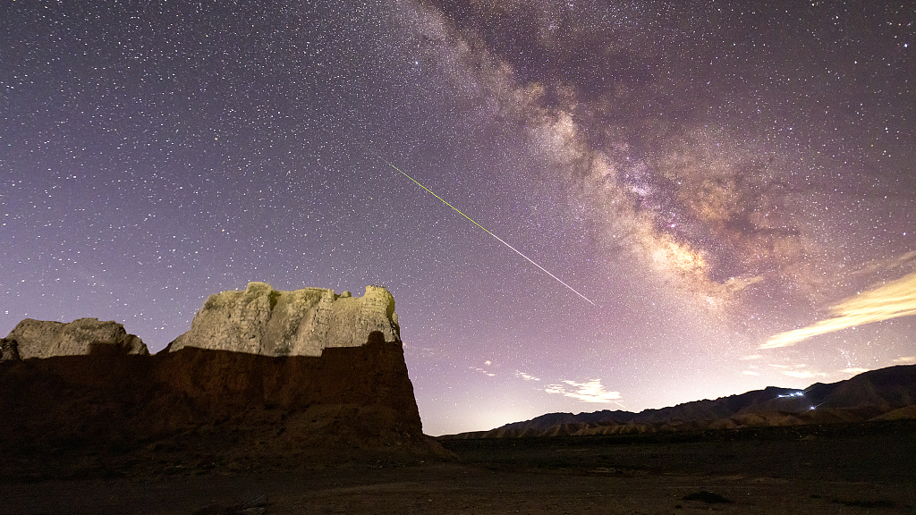 This photo taken on August 13, 2023, shows the Perseid meteor shower above Yongtai Ancient City in Baiyin, Gansu, China. /CFP