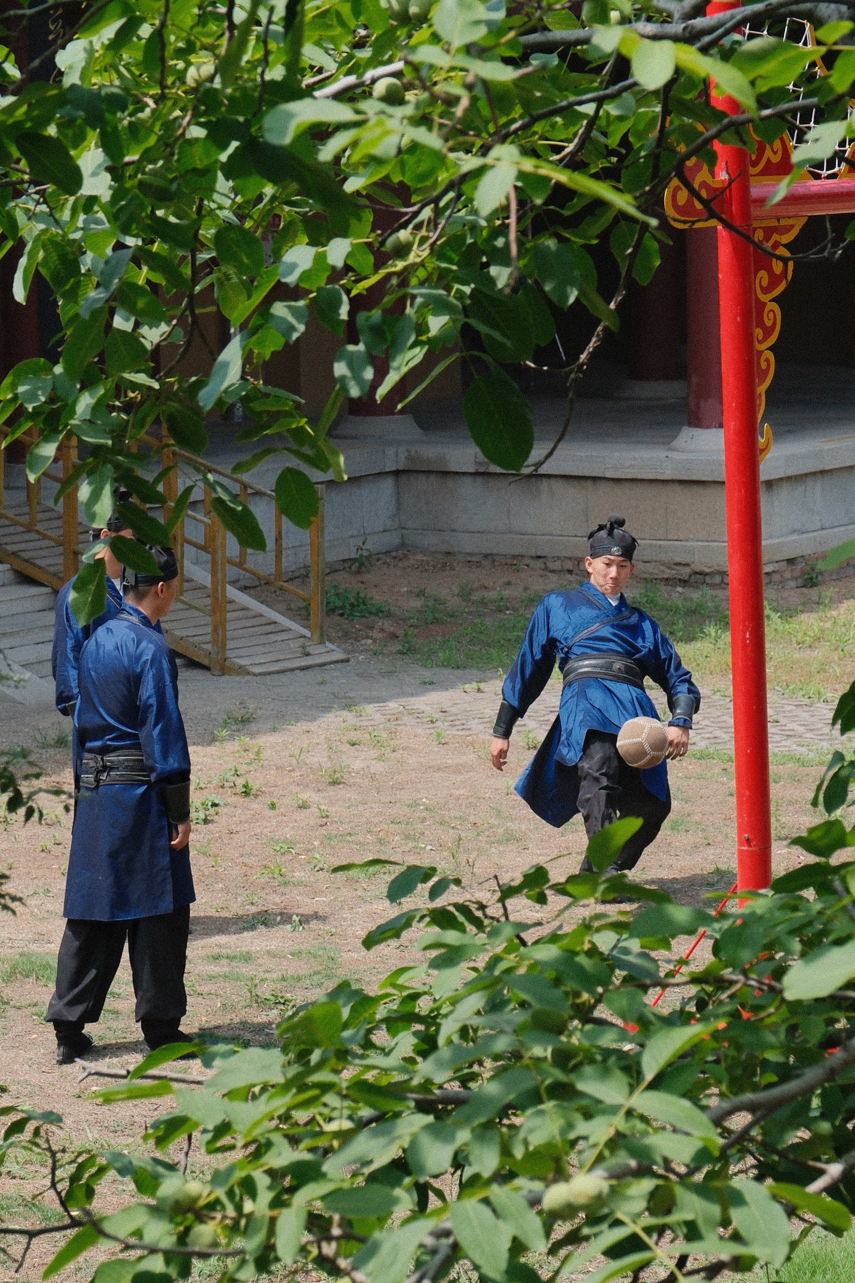 This undated photo shows people playing cuju dressed in traditional costumes in Zibo, east China's Shandong Province. /CGTN