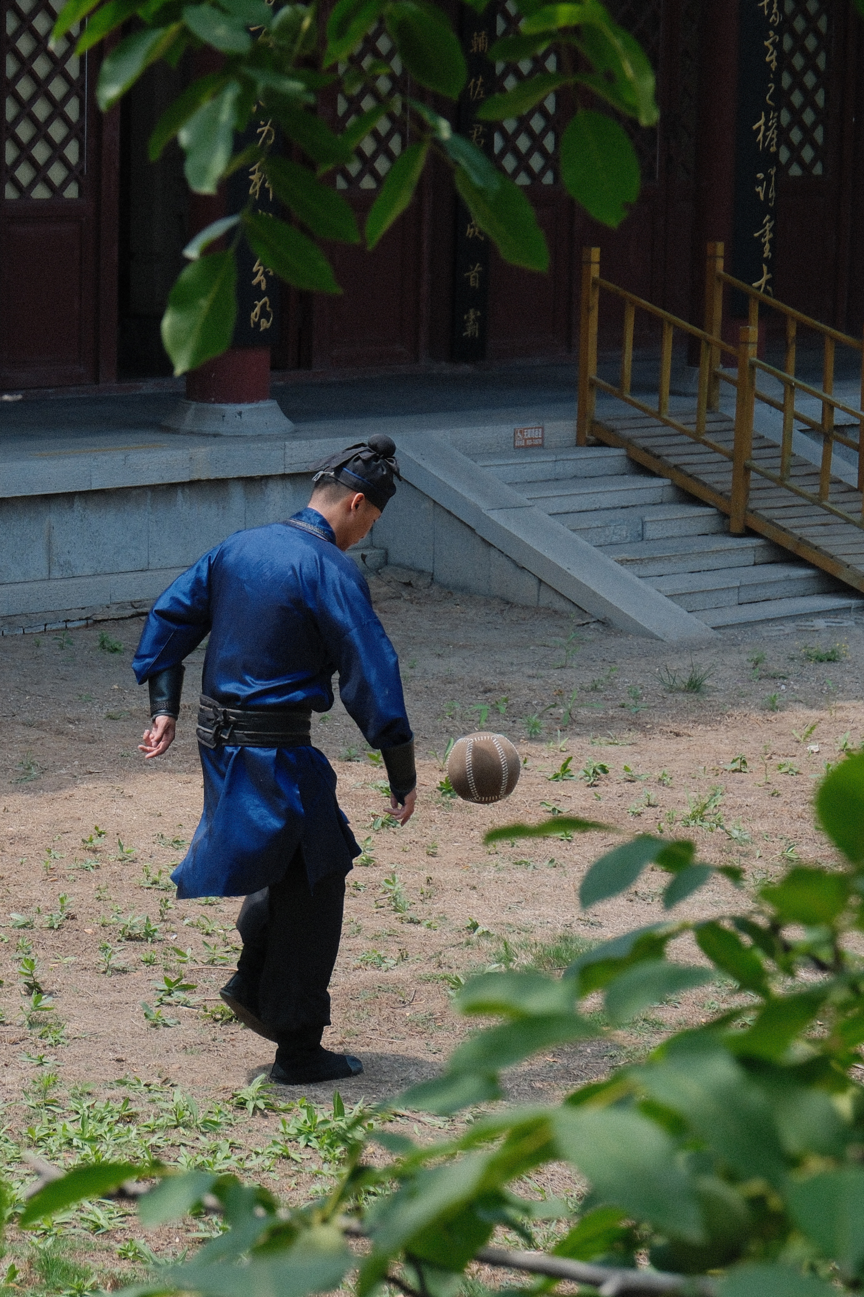 This undated photo shows people playing cuju dressed in traditional costumes in Zibo, east China's Shandong Province. /CGTN