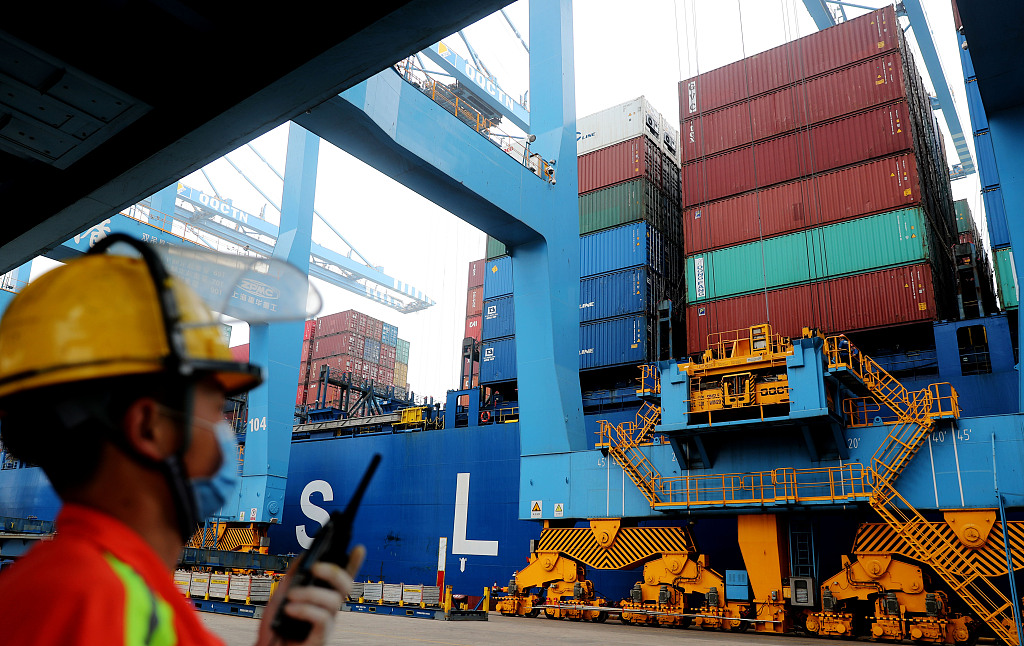 A freighter loads cargos for export to South Africa at a pilot free trade zone in Qingdao, east China's Shandong Province, June 22, 2022. /CFP