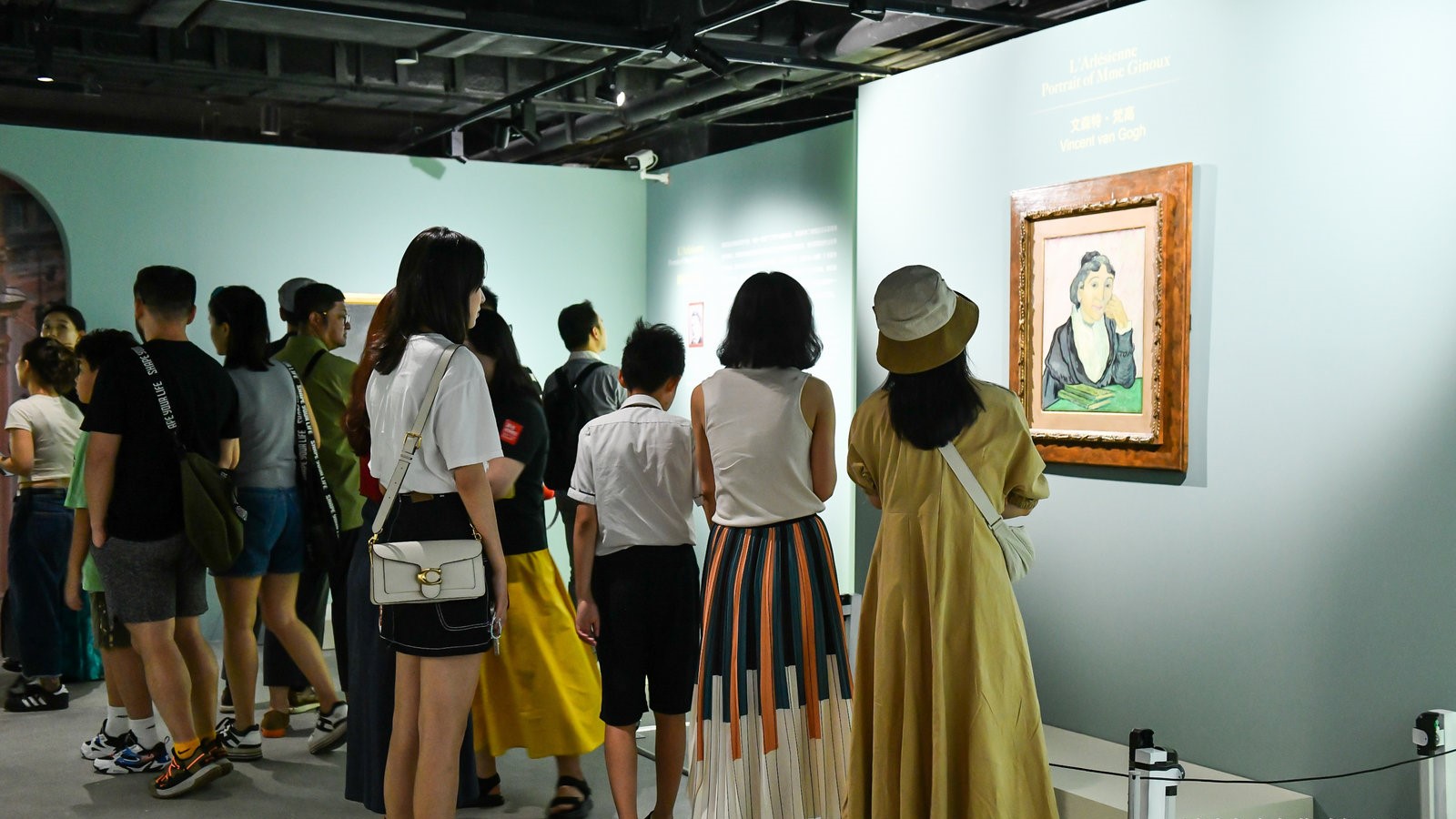 Visitors look at a painting by Vincent Van Gogh /Meet You Museum