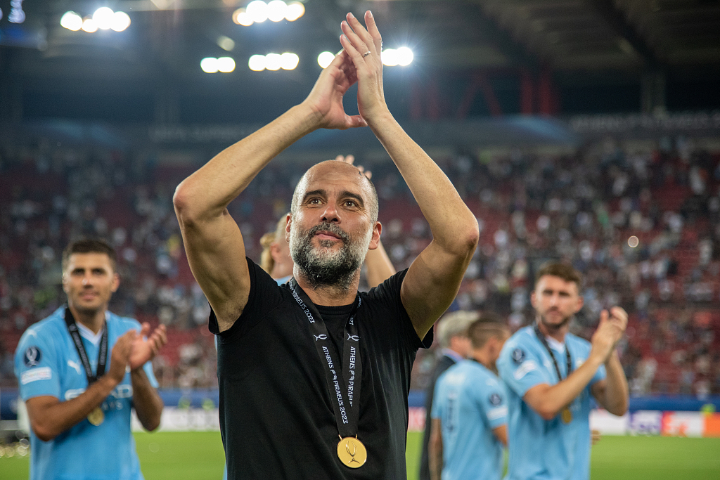 Manchester City manager Pep Guardiola acknowledge the fans after winning the UEFA Super Cup at Georgios Karaiskakis stadium in Piraeus port, Athens, Greece, August 16, 2023. /CFP